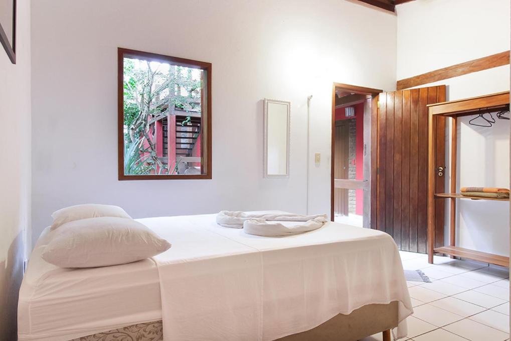Novos Baianos Hostel E Pousada بورتو سيغورو المظهر الخارجي الصورة A room at the hotel