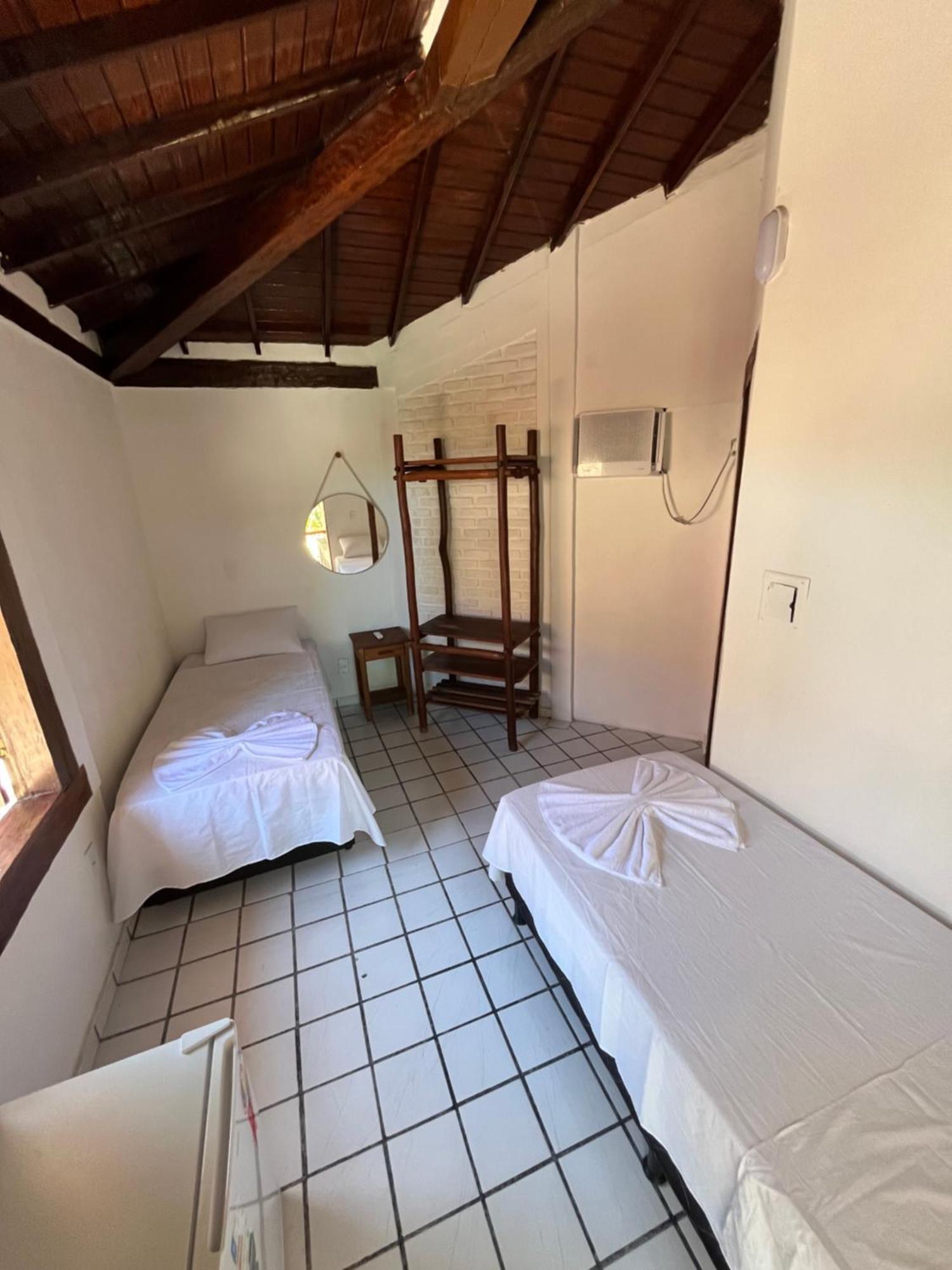 Novos Baianos Hostel E Pousada بورتو سيغورو المظهر الخارجي الصورة A room at the hotel